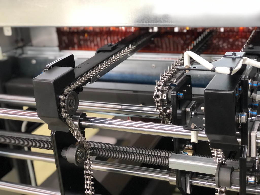 Precision steel conveyor chain and guide rails